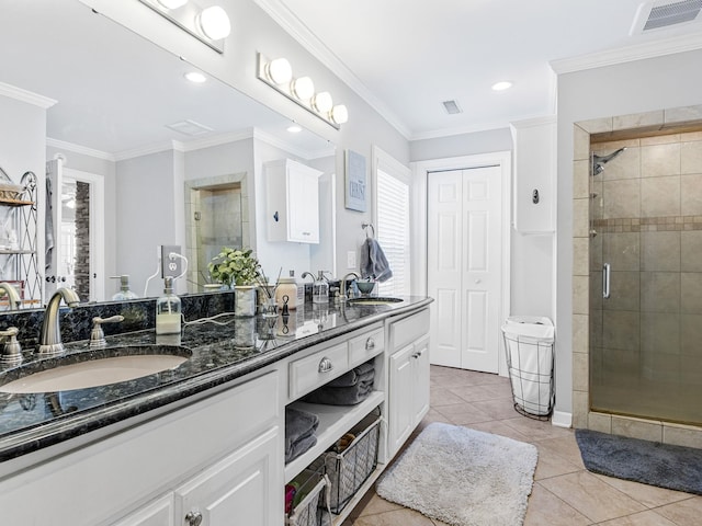 bathroom with tile patterned flooring, an enclosed shower, vanity, and crown molding