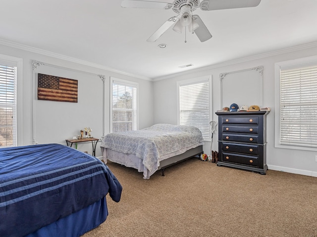 carpeted bedroom featuring ceiling fan and ornamental molding