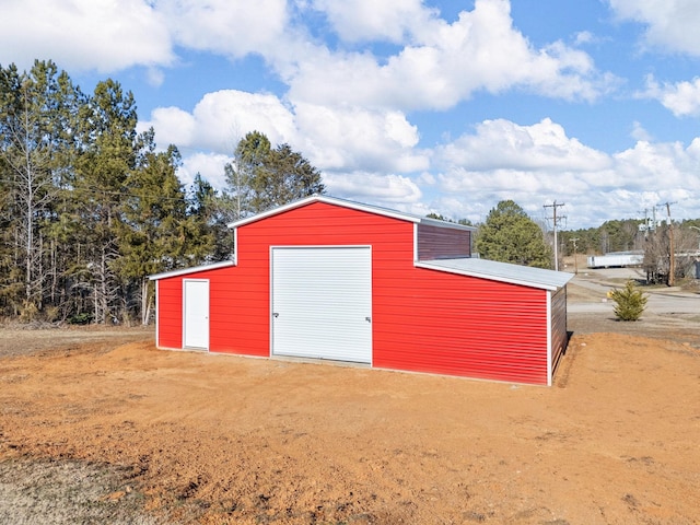 view of outdoor structure with a garage