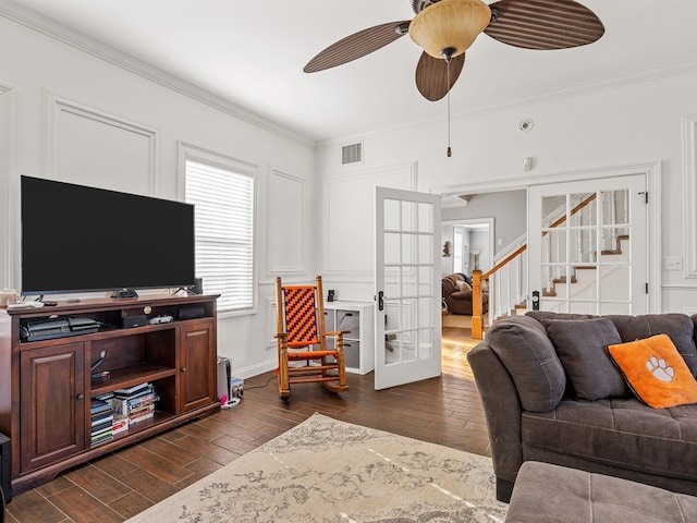 living room featuring ornamental molding, french doors, and ceiling fan