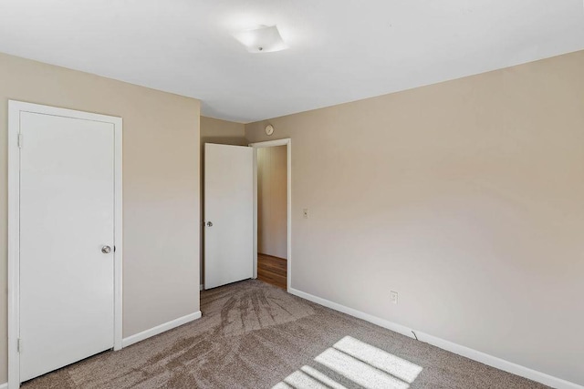 unfurnished bedroom with carpet