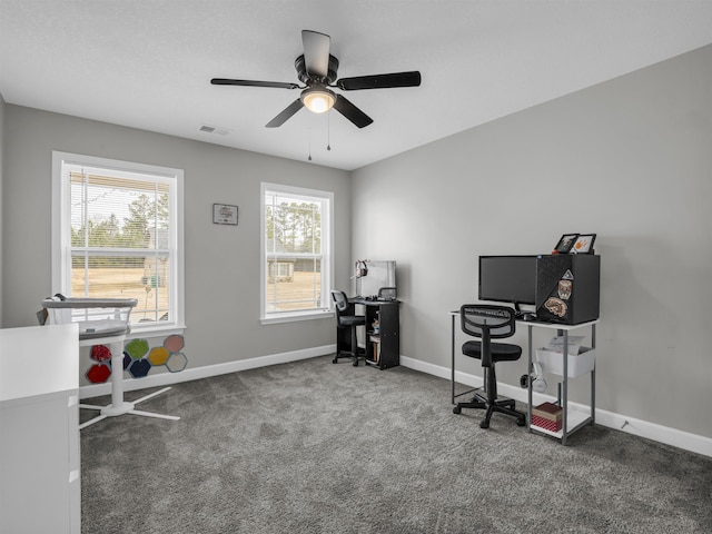 office with carpet floors and ceiling fan