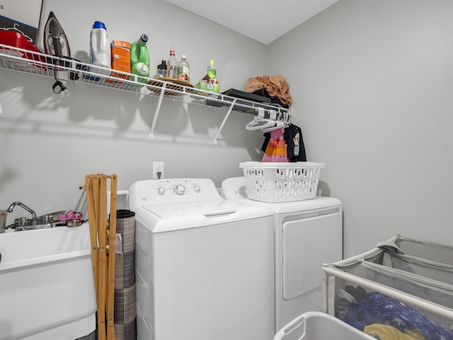 laundry area featuring sink and washing machine and clothes dryer