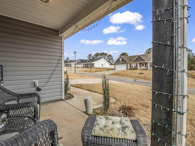 view of patio featuring a garage