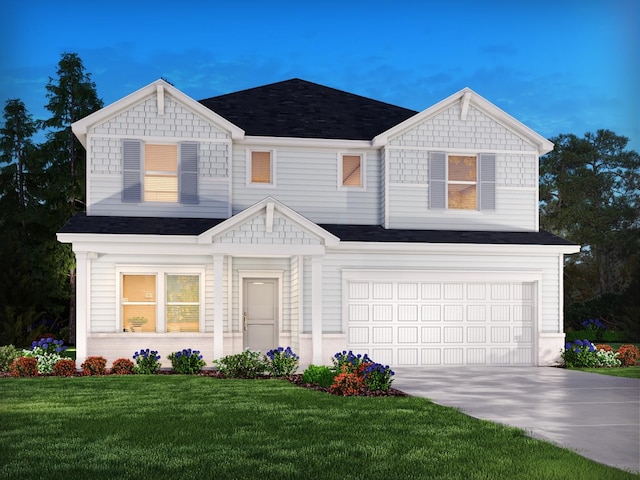 view of front facade featuring a garage and a front yard