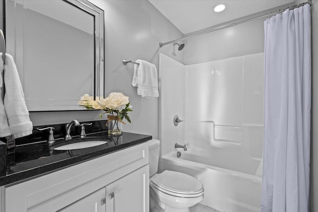 full bathroom with shower / tub combo with curtain, vanity, and toilet