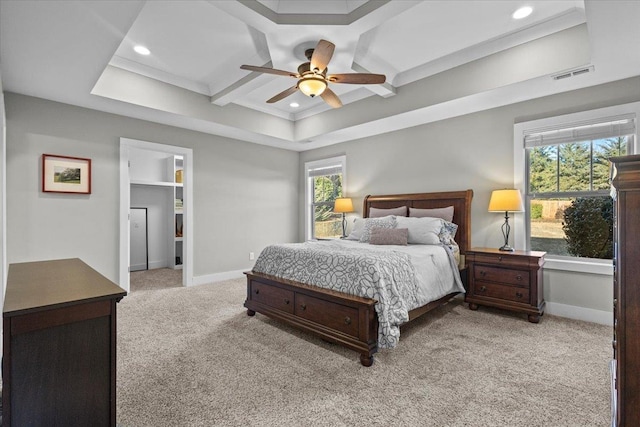 carpeted bedroom with multiple windows, coffered ceiling, and ceiling fan