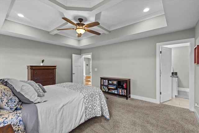 carpeted bedroom with ceiling fan, ornamental molding, and ensuite bath