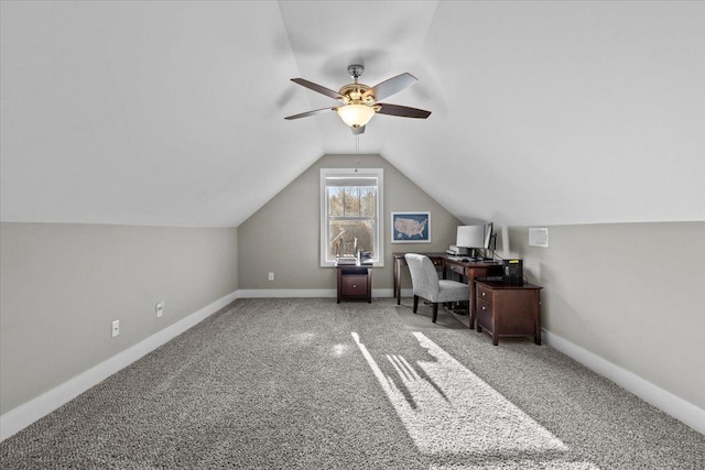 carpeted home office with ceiling fan and lofted ceiling