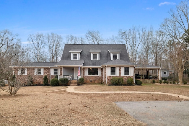 cape cod house featuring a front yard and a porch