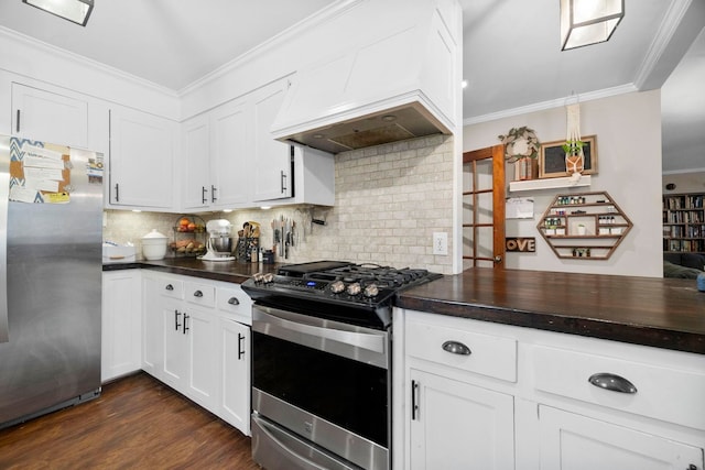 kitchen featuring decorative backsplash, stainless steel appliances, custom exhaust hood, and white cabinets