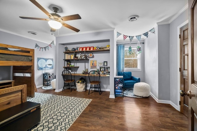 home office featuring dark hardwood / wood-style flooring, crown molding, and ceiling fan