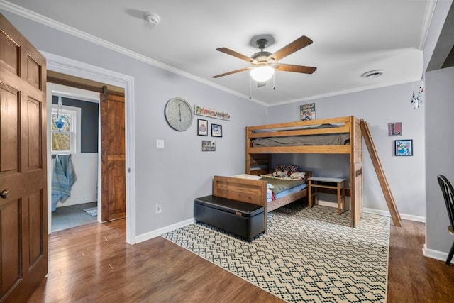 bedroom featuring ornamental molding, dark hardwood / wood-style floors, and ceiling fan