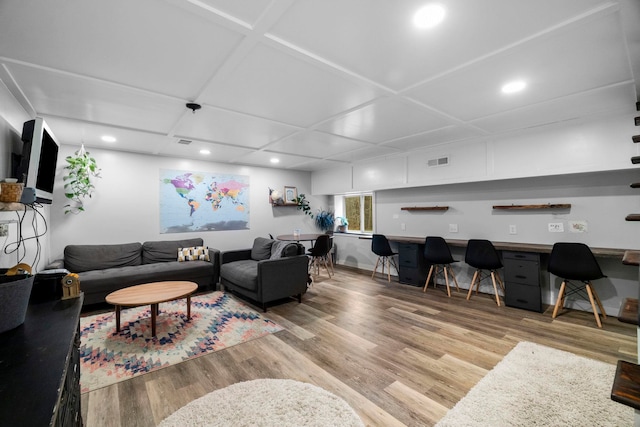 living room featuring hardwood / wood-style flooring and built in desk