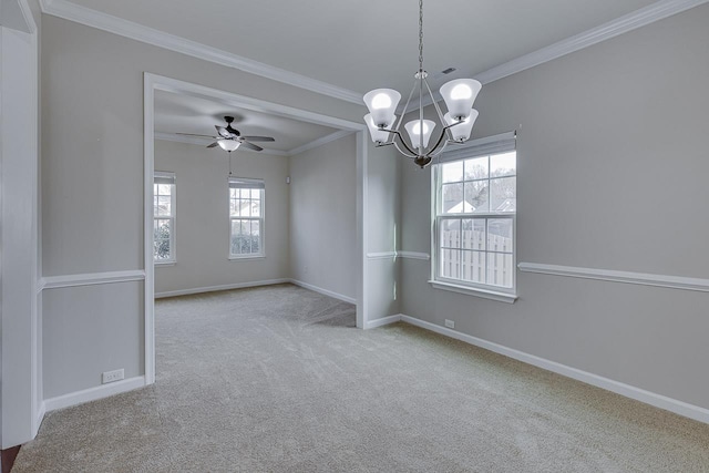 carpeted spare room featuring crown molding and ceiling fan with notable chandelier