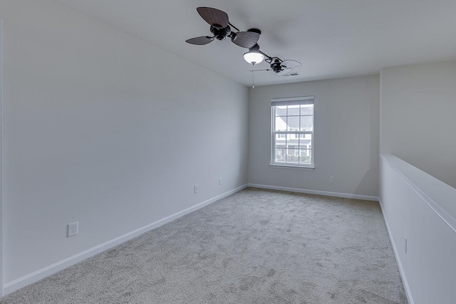 unfurnished room with light carpet and ceiling fan