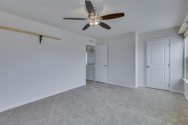 unfurnished bedroom featuring light colored carpet and ceiling fan