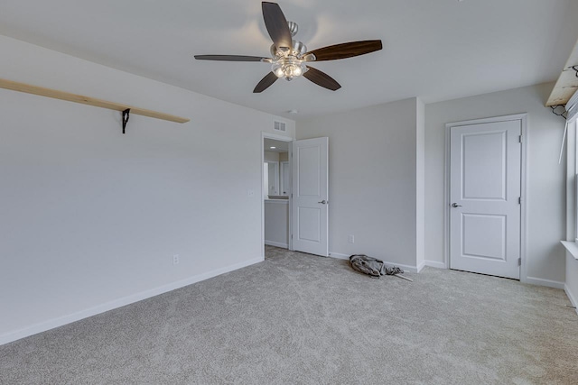 unfurnished bedroom featuring ceiling fan and light carpet