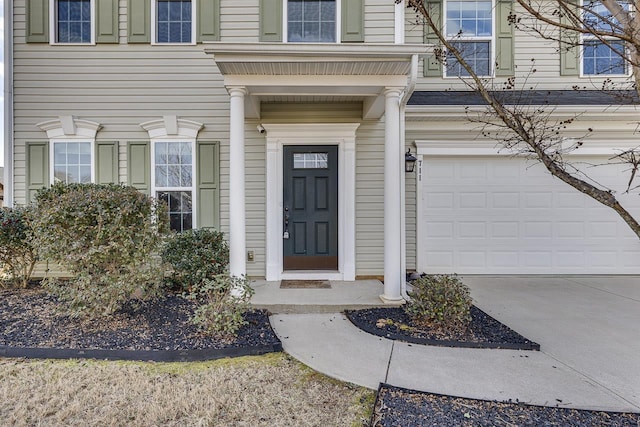 entrance to property featuring a garage