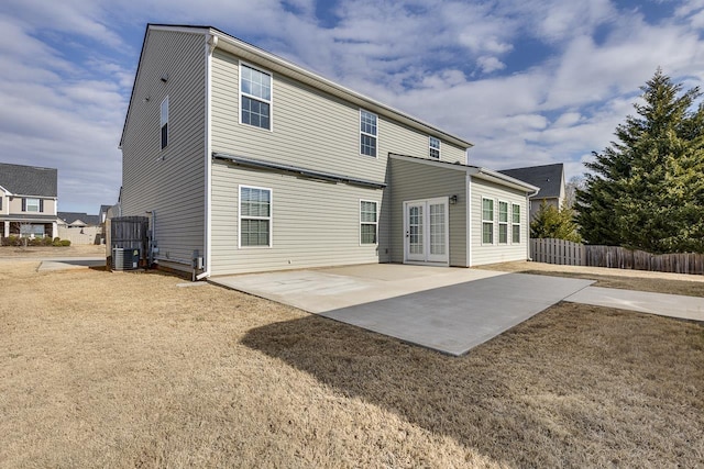 back of property featuring a patio and central air condition unit