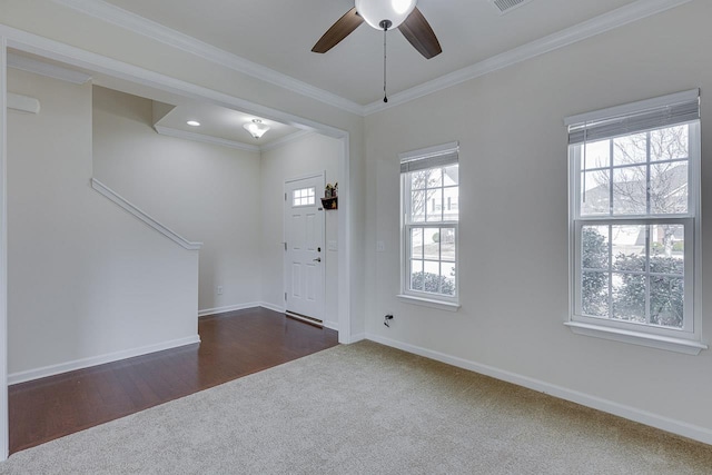 foyer with crown molding, dark hardwood / wood-style flooring, and ceiling fan