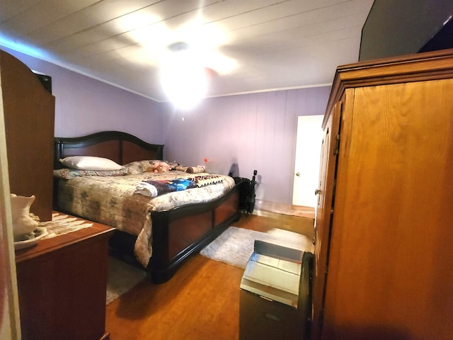 bedroom with hardwood / wood-style flooring