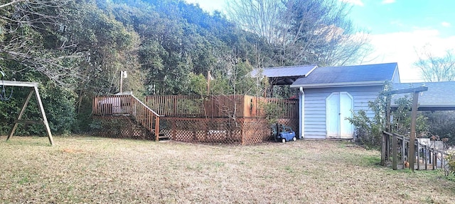 view of yard with a shed and a wooden deck