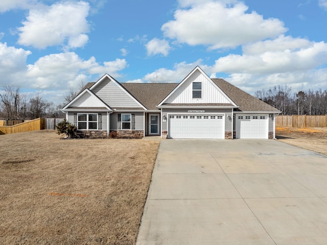 view of front facade with a garage and a front yard