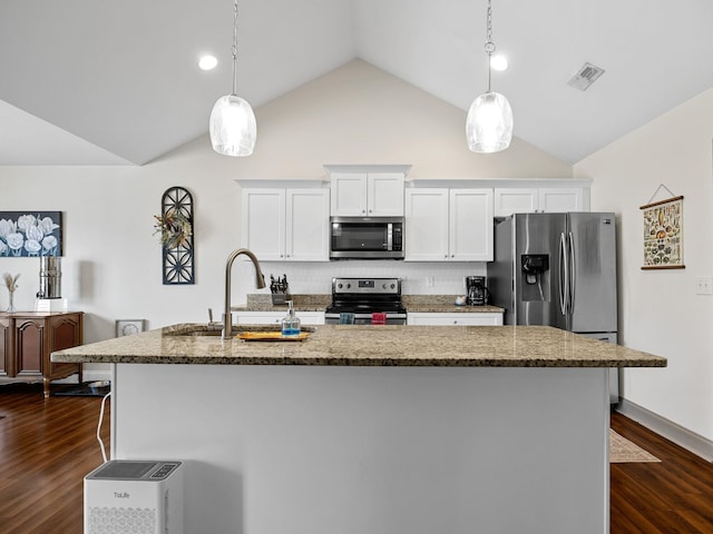 kitchen featuring sink, white cabinetry, a center island with sink, pendant lighting, and stainless steel appliances