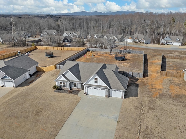 birds eye view of property featuring a mountain view