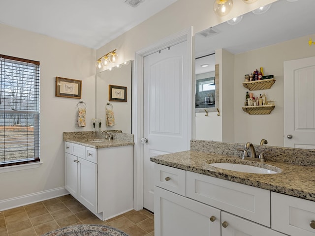 bathroom featuring vanity and tile patterned flooring