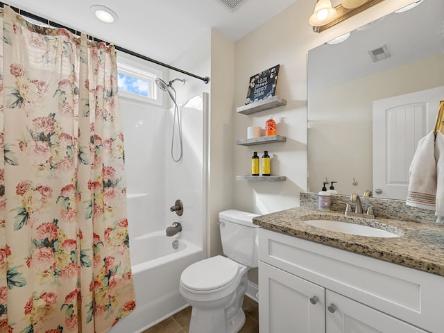 full bathroom featuring tile patterned flooring, vanity, shower / bath combination with curtain, and toilet