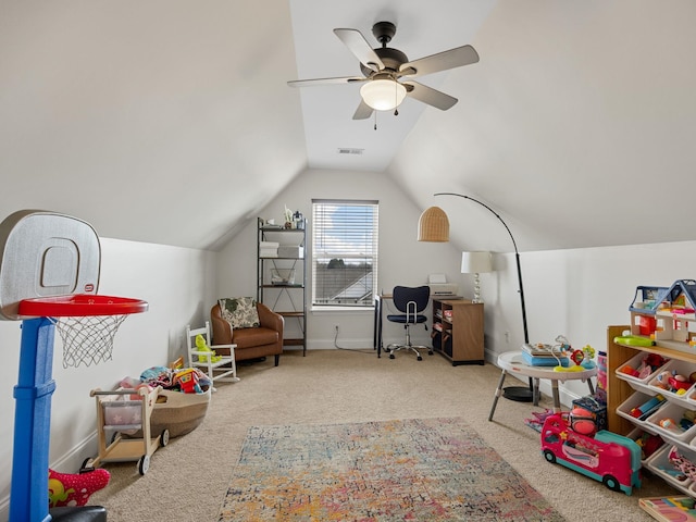 playroom featuring carpet floors, vaulted ceiling, and ceiling fan