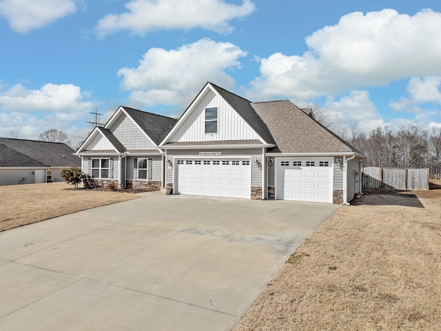 view of front of property featuring a garage and a front yard