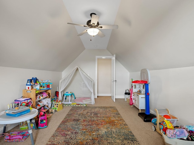 playroom featuring ceiling fan, lofted ceiling, and light carpet