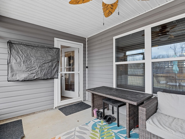 exterior space featuring ceiling fan