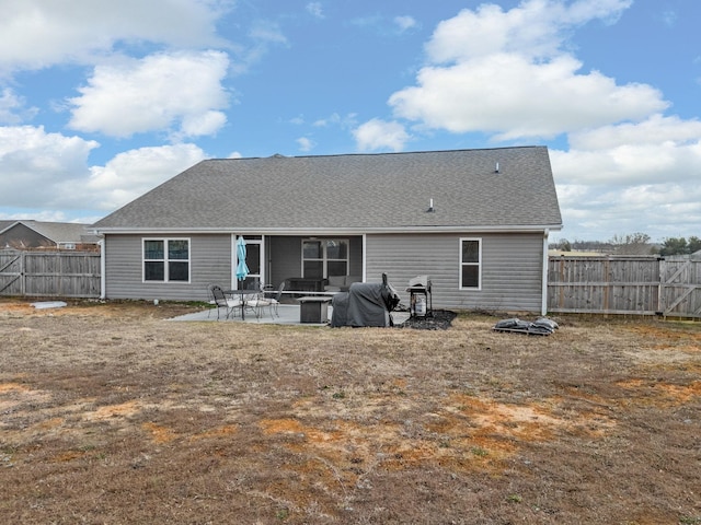 back of house with a patio