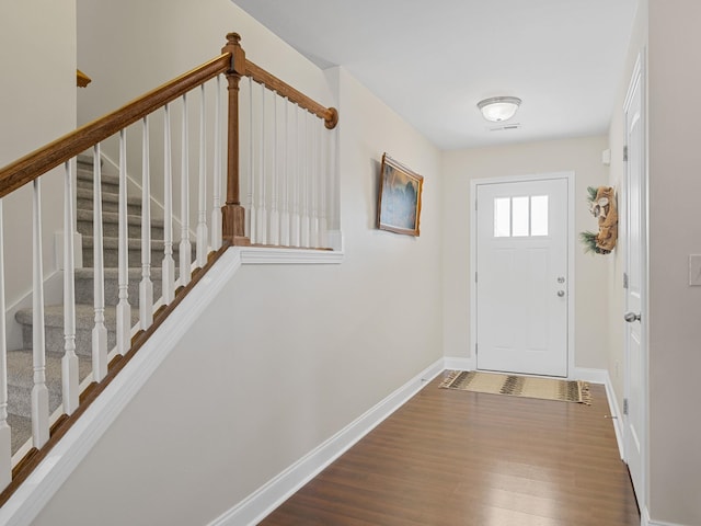 entryway with hardwood / wood-style floors