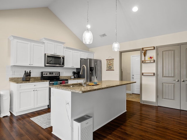 kitchen featuring high vaulted ceiling, stainless steel appliances, white cabinets, and a center island with sink