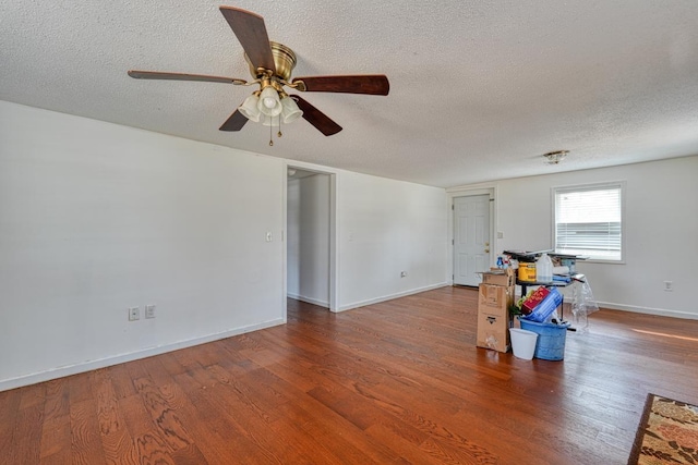 spare room featuring ceiling fan, hardwood / wood-style floors, and a textured ceiling