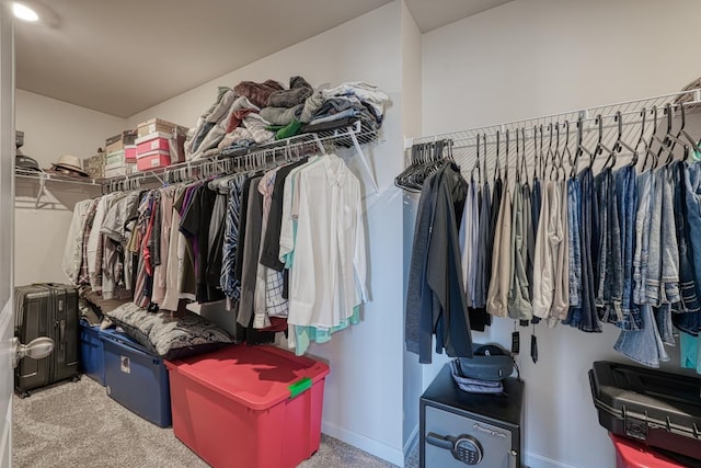 walk in closet featuring carpet