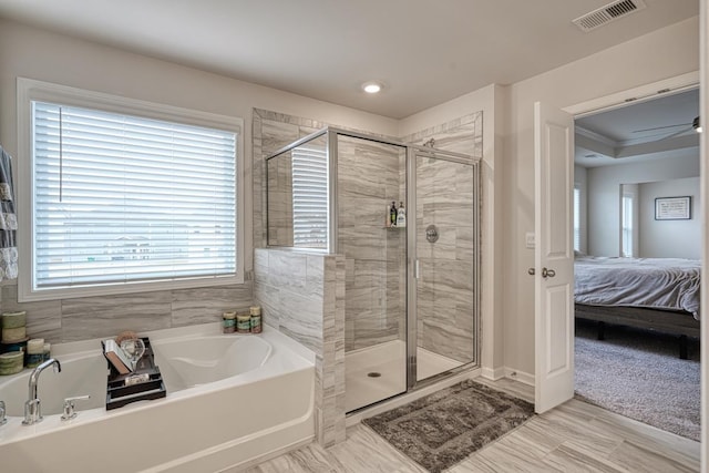 bathroom with crown molding and independent shower and bath