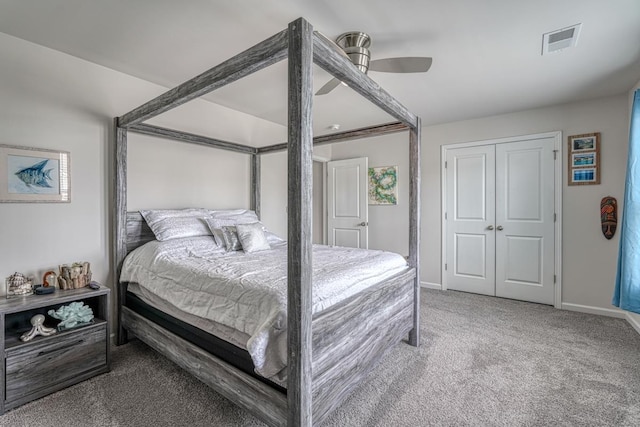 bedroom with ceiling fan, carpet floors, and a closet