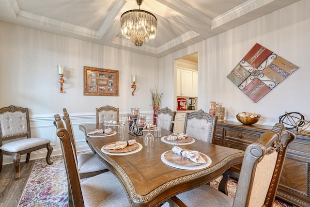 dining room with coffered ceiling, hardwood / wood-style floors, and a chandelier