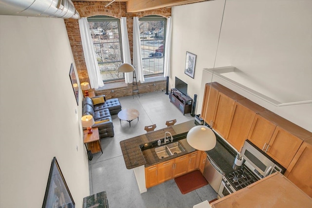 living room with brick wall and sink