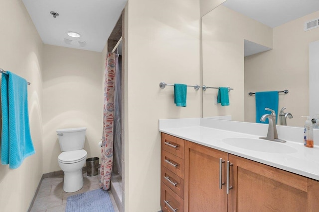 bathroom with vanity, toilet, curtained shower, and tile patterned flooring