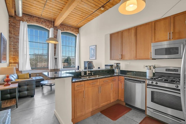 kitchen with sink, wooden ceiling, kitchen peninsula, beamed ceiling, and stainless steel appliances