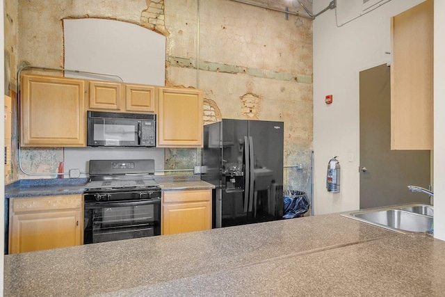 kitchen featuring sink, backsplash, black appliances, and light brown cabinets