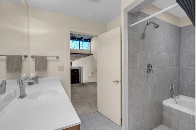 bathroom featuring vanity, tiled shower / bath combo, and tile patterned floors