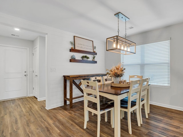 dining room with dark hardwood / wood-style floors